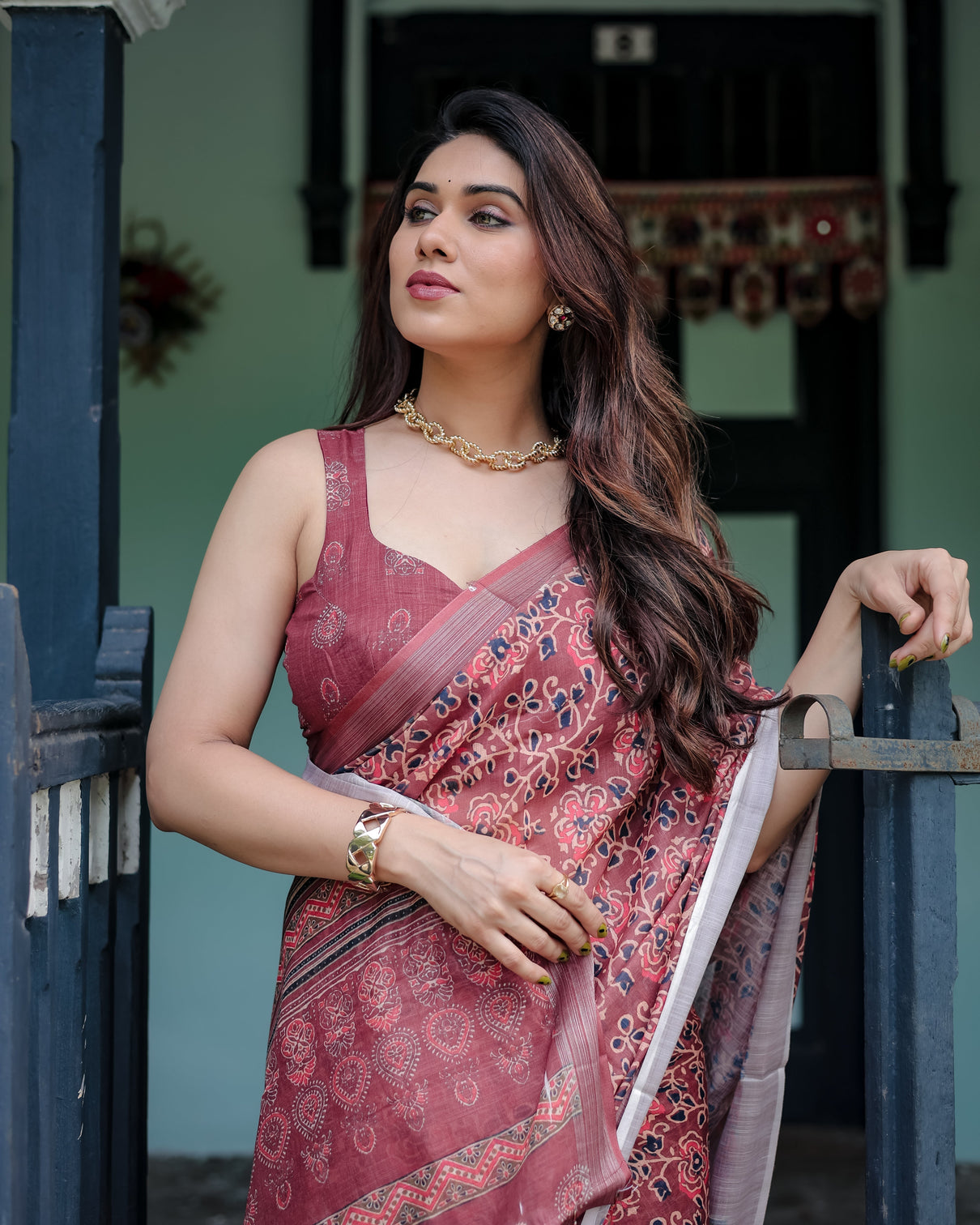 Rust red pure cotton linen saree with floral block print blouse and tassel detailing