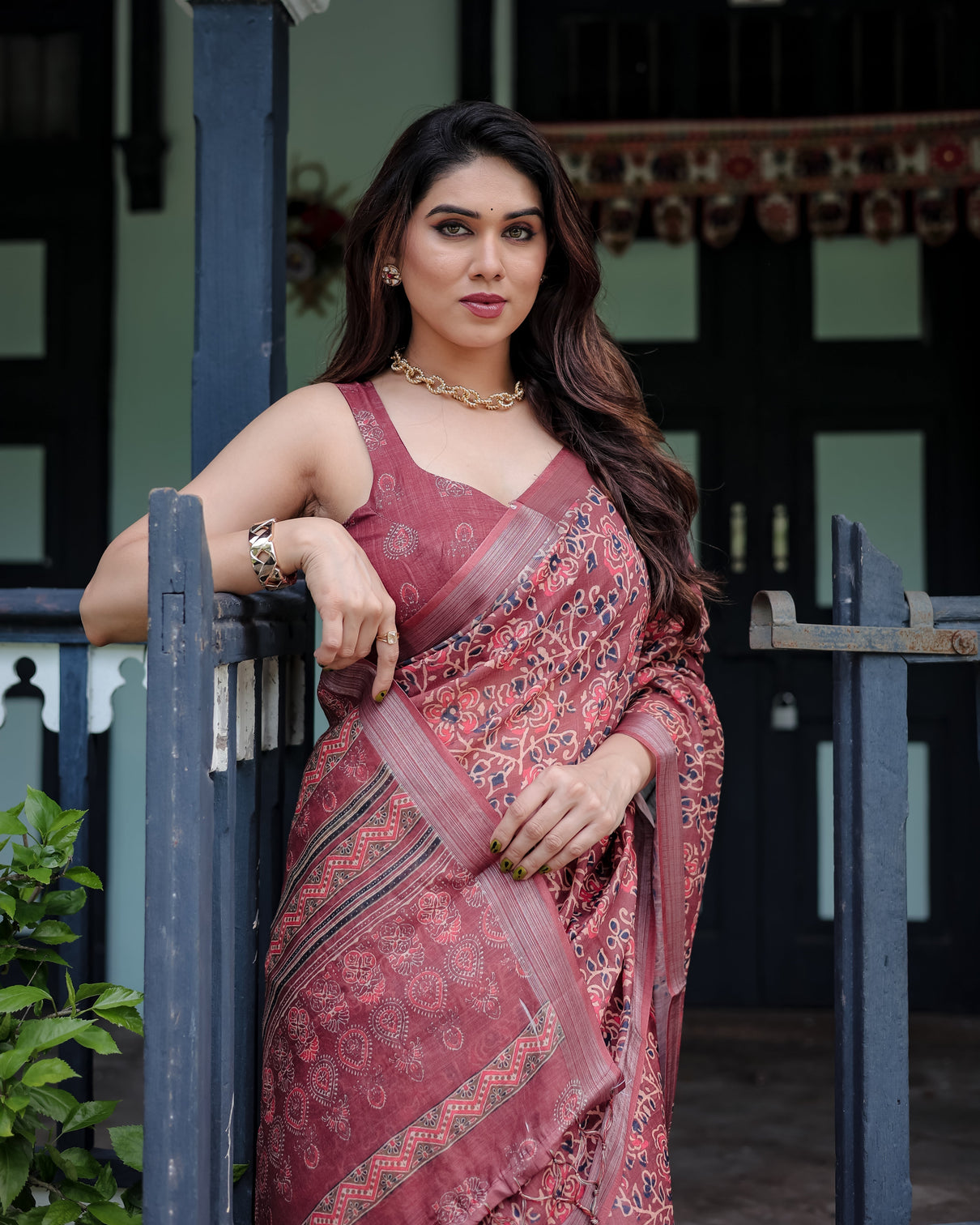 Rust red pure cotton linen saree with floral block print blouse and tassel detailing