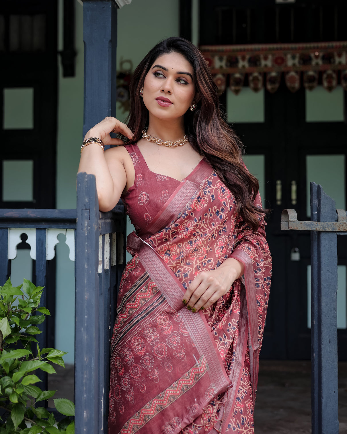 Rust red pure cotton linen saree with floral block print blouse and tassel detailing