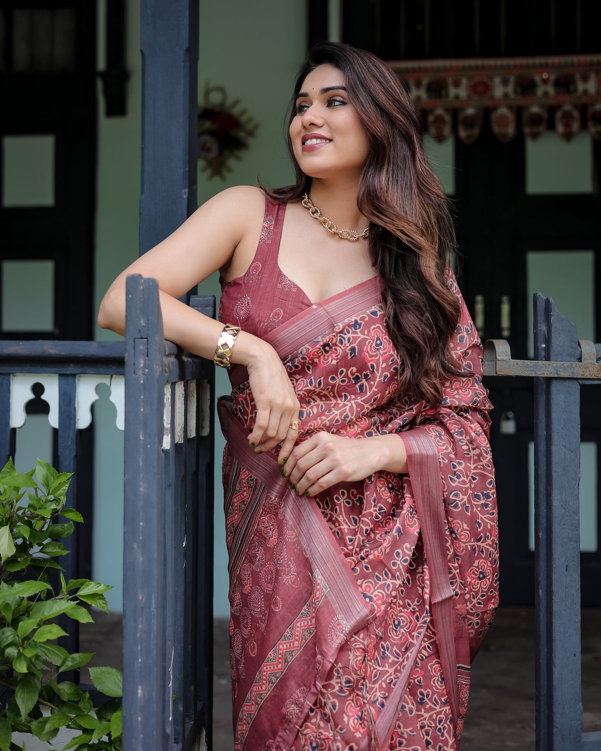 Rust red pure cotton linen saree with floral block print blouse and tassel detailing
