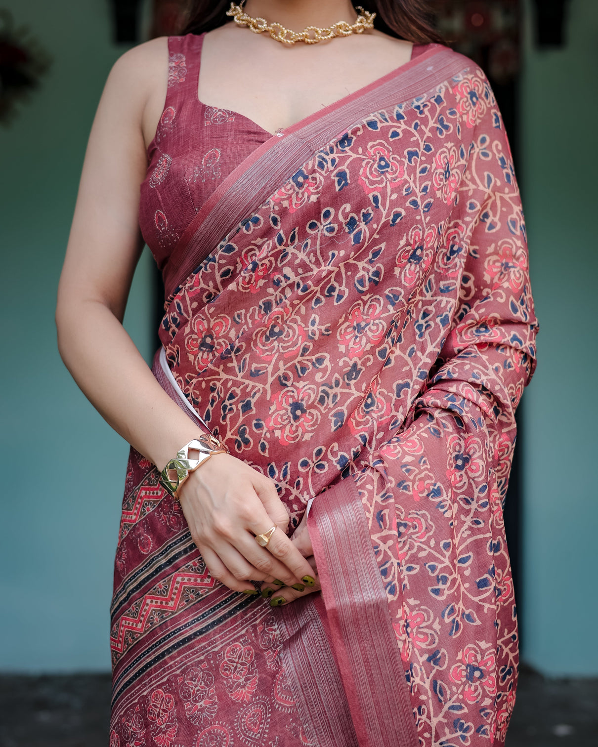 Rust red pure cotton linen saree with floral block print blouse and tassel detailing