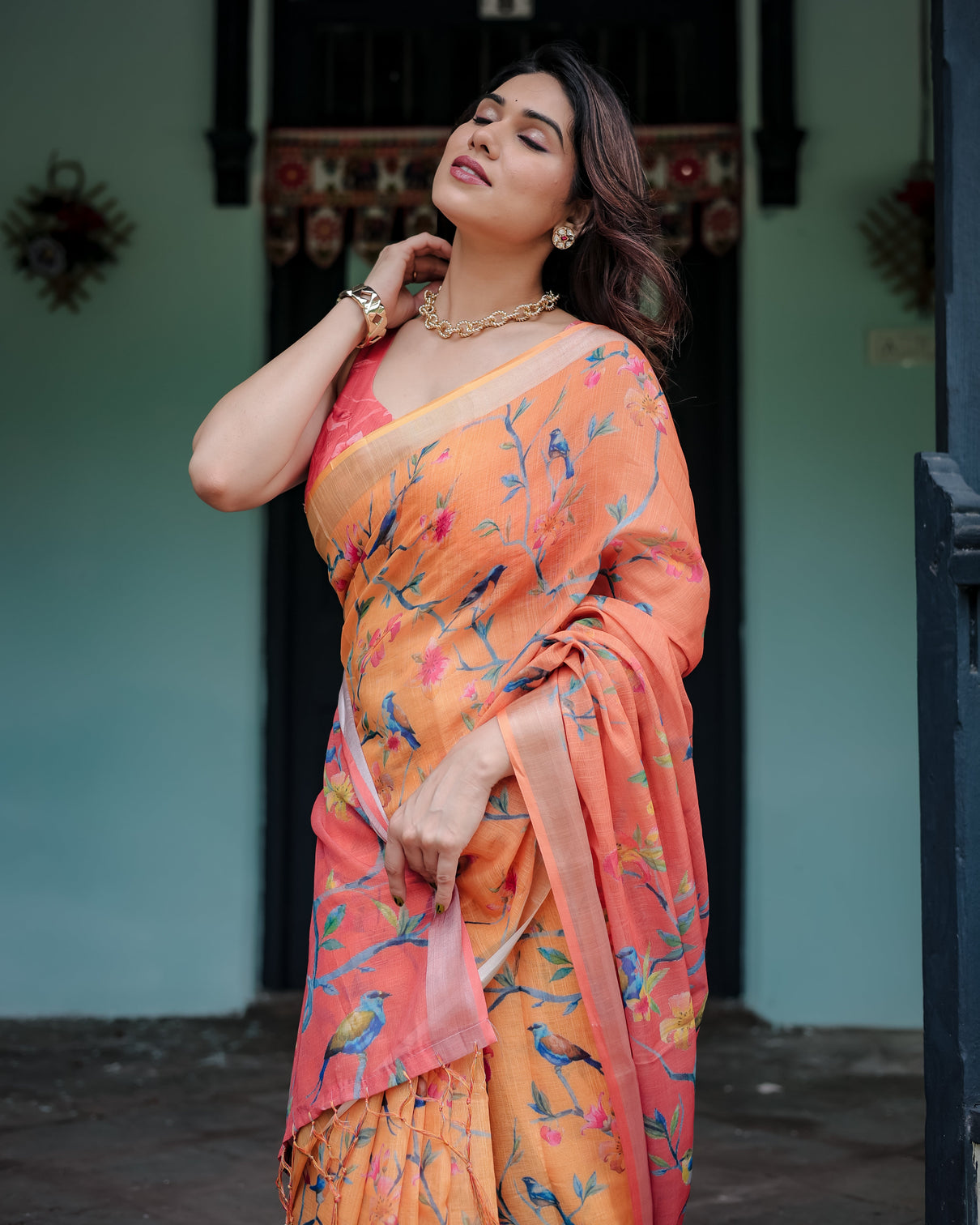 Peach and orange pure cotton linen saree with floral and bird print blouse and tassel detailing