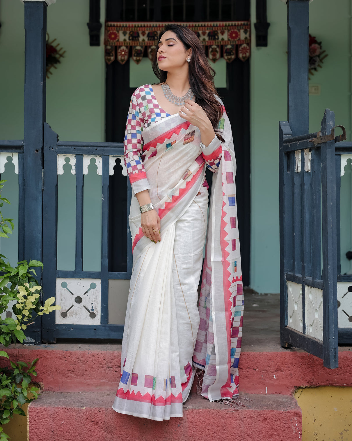 White pure cotton linen saree with multicolor checkered design blouse and tassel detailing