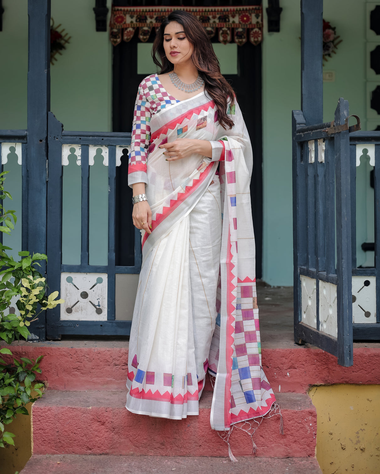 White pure cotton linen saree with multicolor checkered design blouse and tassel detailing