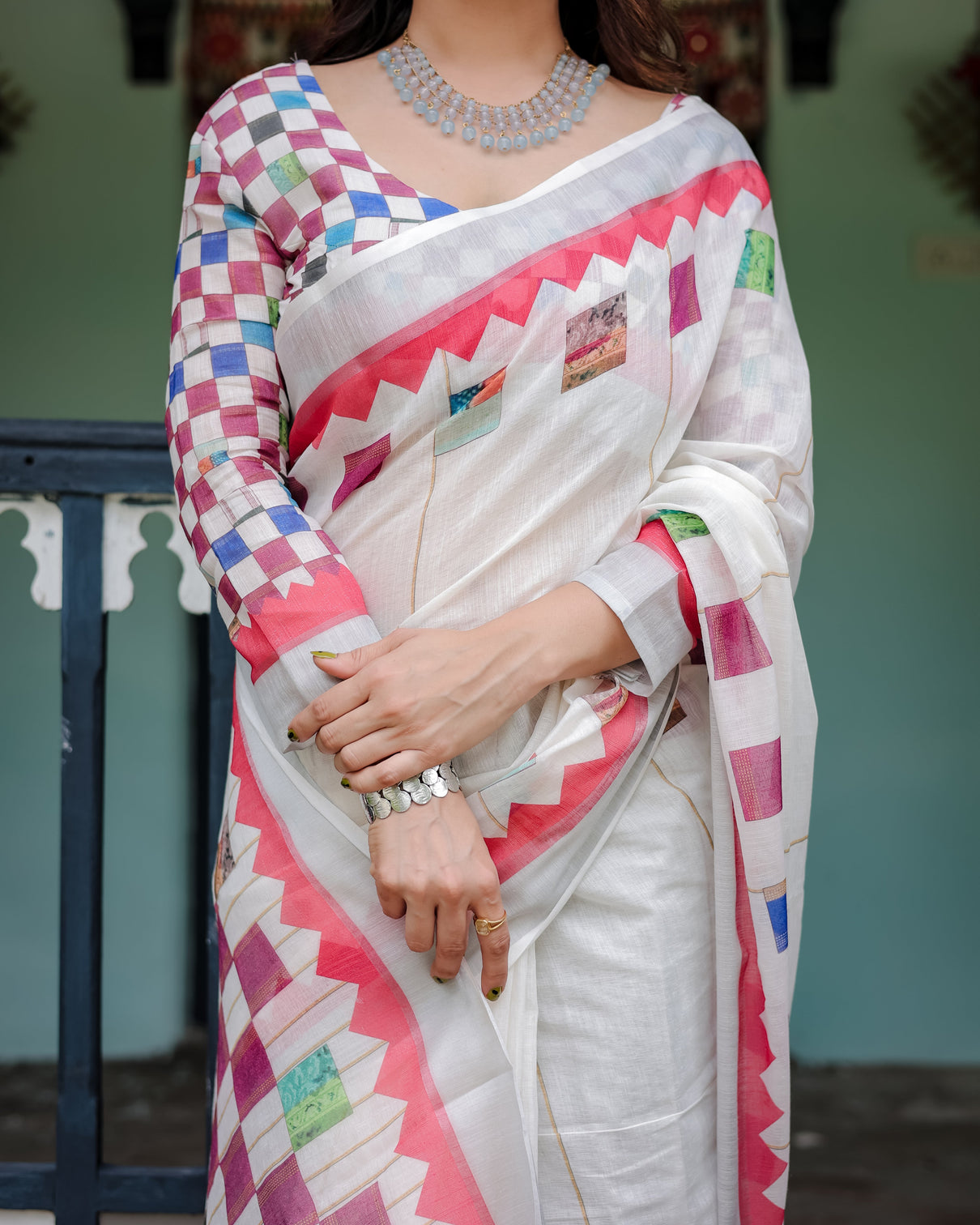 White pure cotton linen saree with multicolor checkered design blouse and tassel detailing