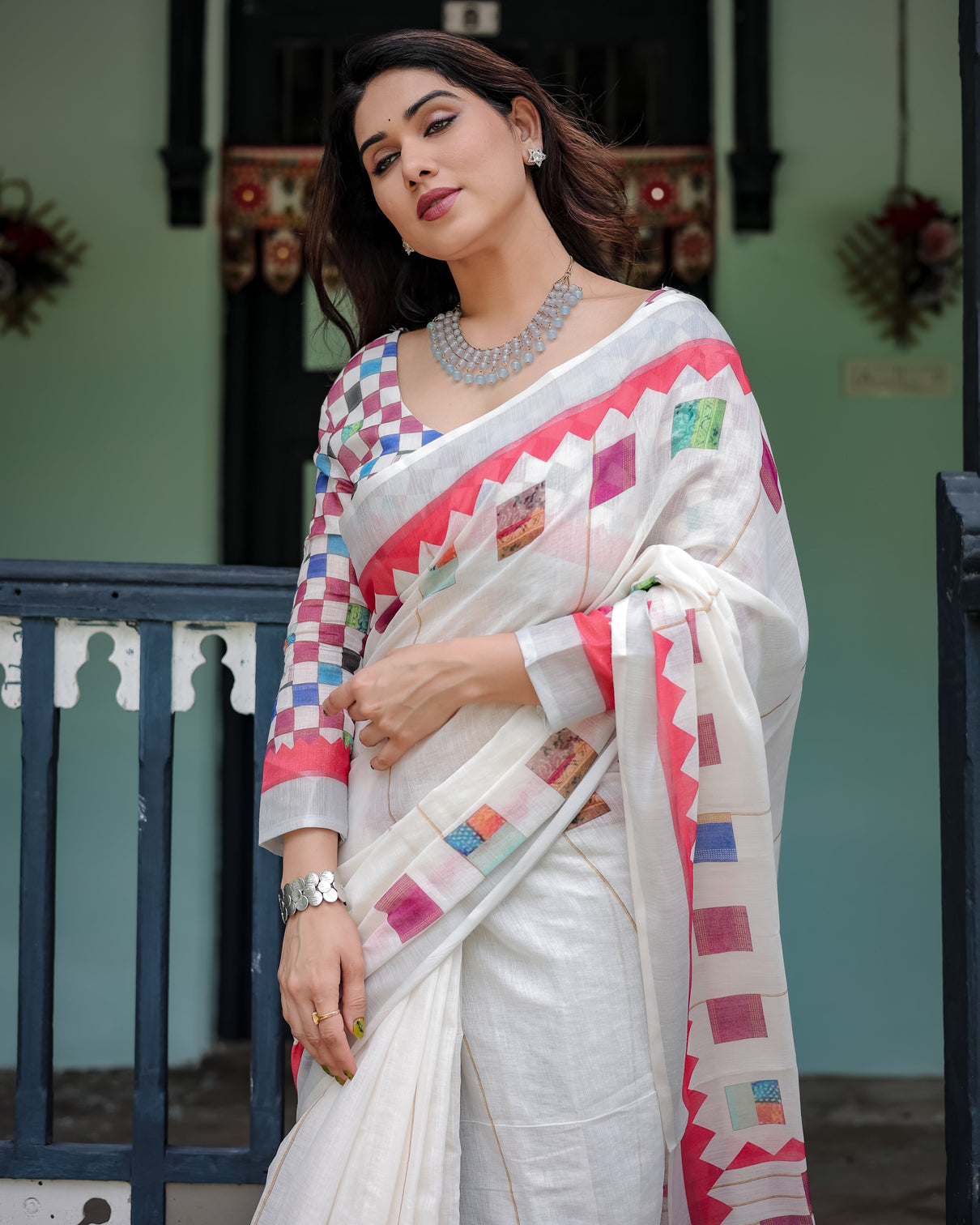 White pure cotton linen saree with multicolor checkered design blouse and tassel detailing
