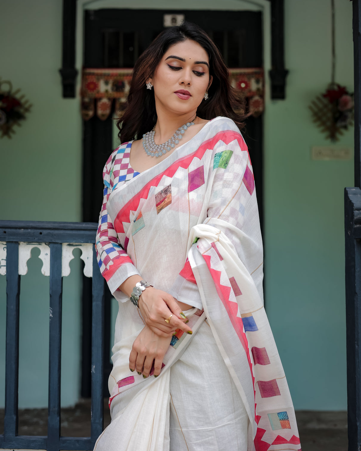 White pure cotton linen saree with multicolor checkered design blouse and tassel detailing