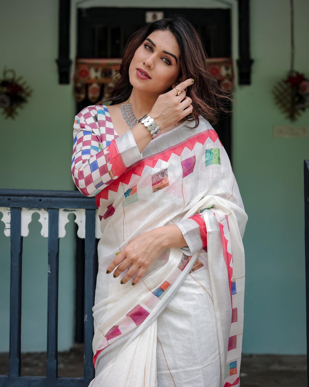White pure cotton linen saree with multicolor checkered design blouse and tassel detailing