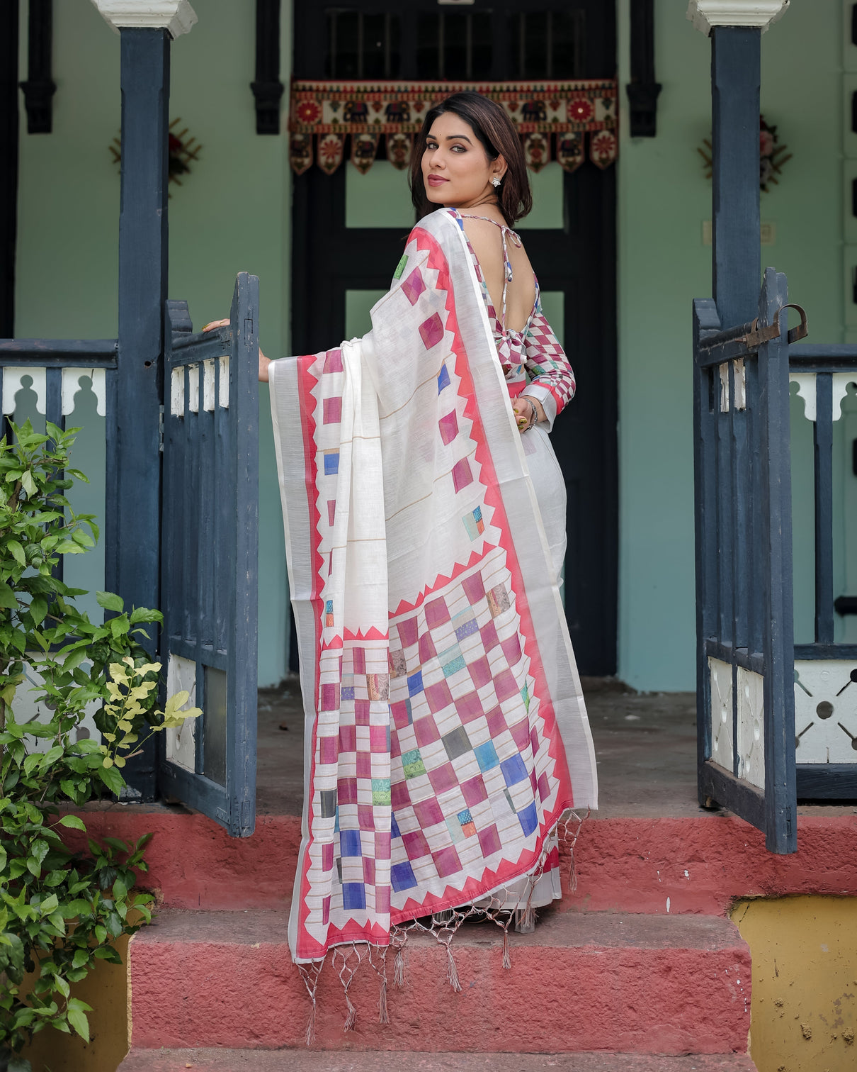 White pure cotton linen saree with multicolor checkered design blouse and tassel detailing