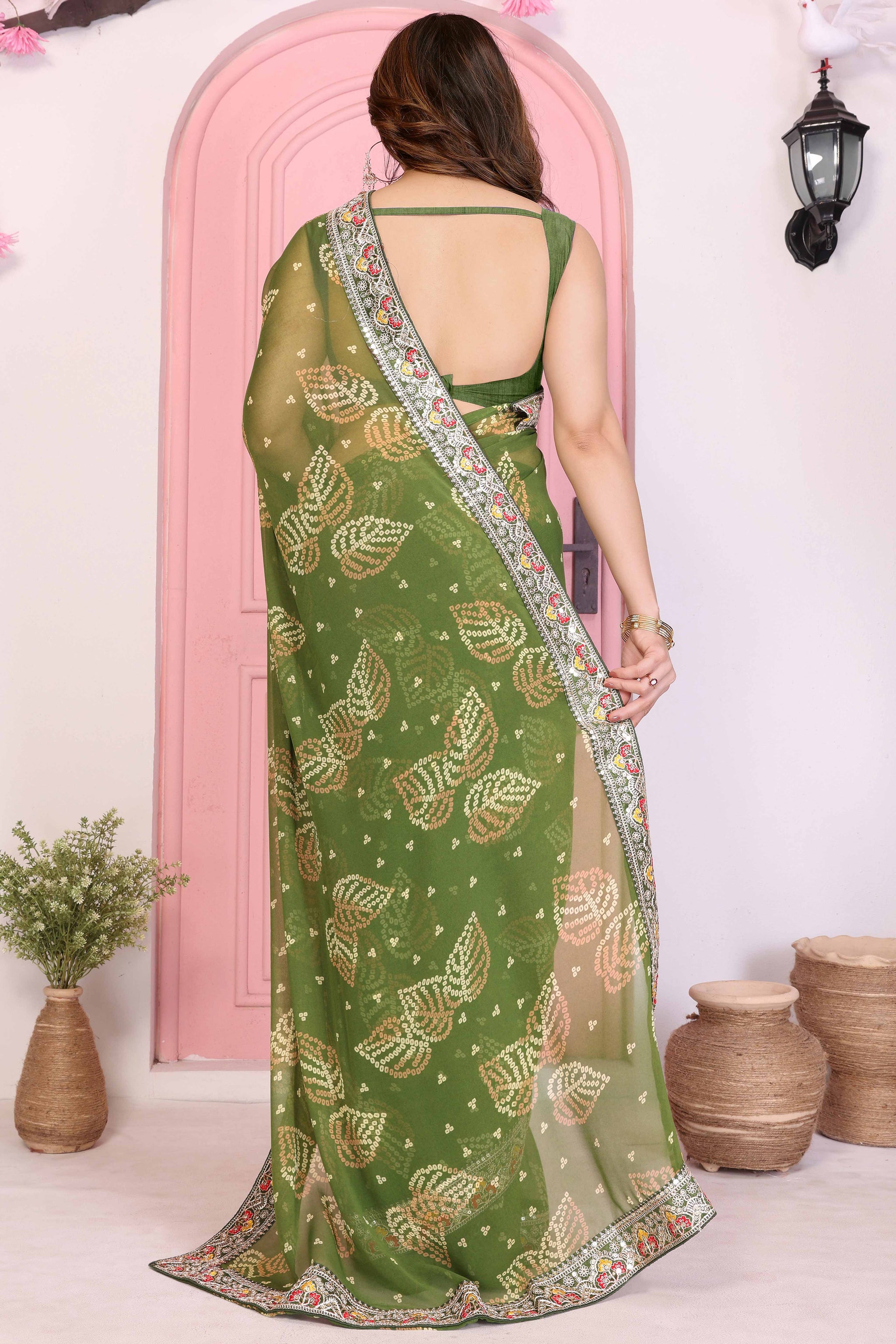 Green Georgette Saree with Traditional Bandhani Print and Lace Accents