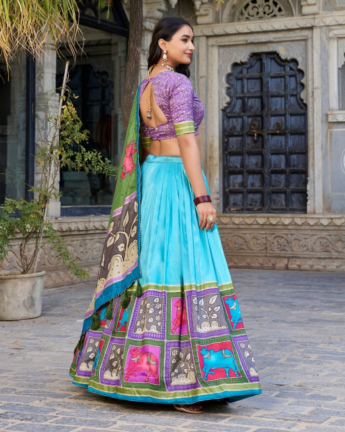 Turquoise blue purple tussar silk kalamkari lehenga choli with elegant foil work