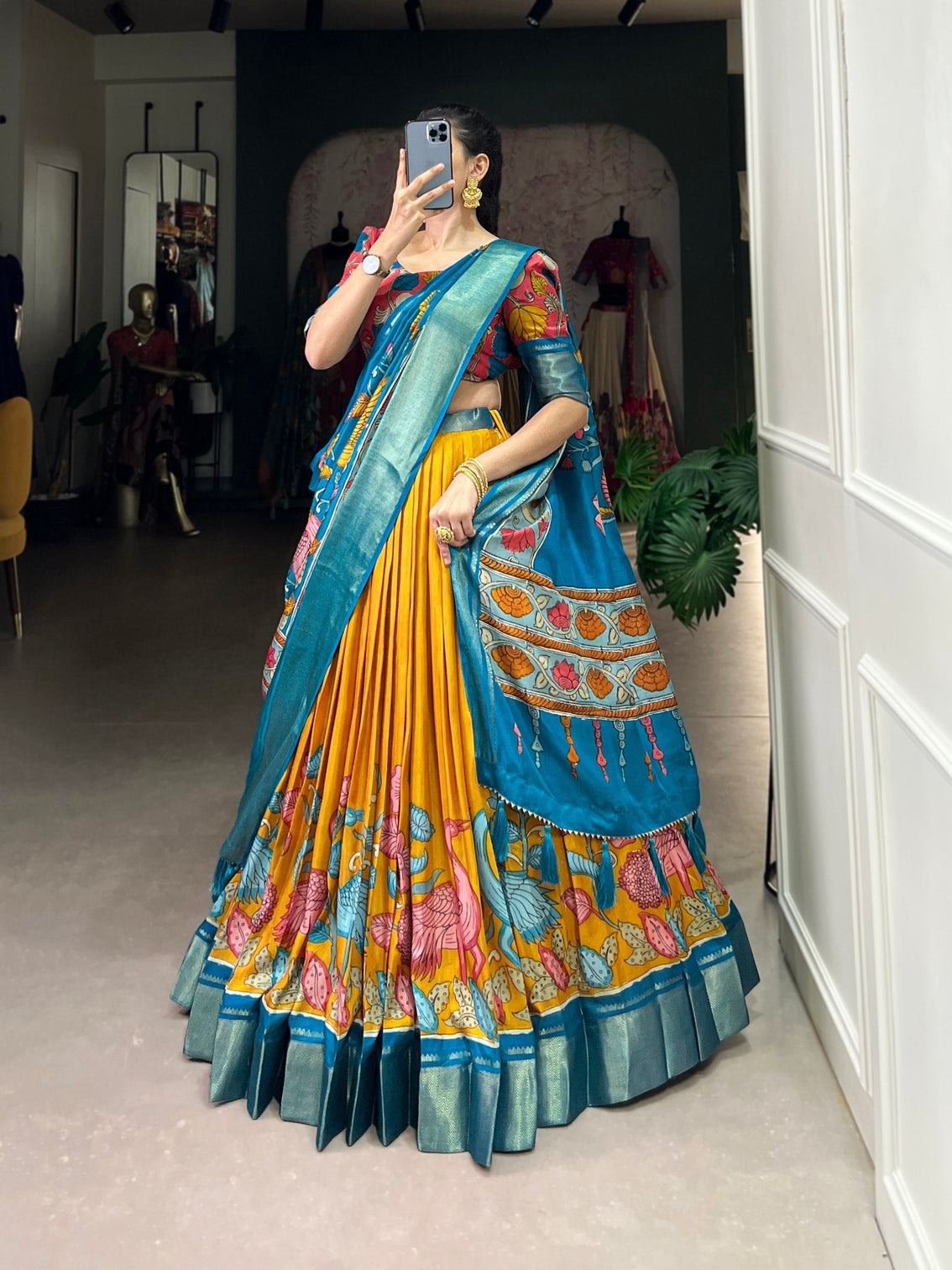 Saffron gold ocean blue kalamkari dola silk lehenga set a regal symphony of tradition luxury