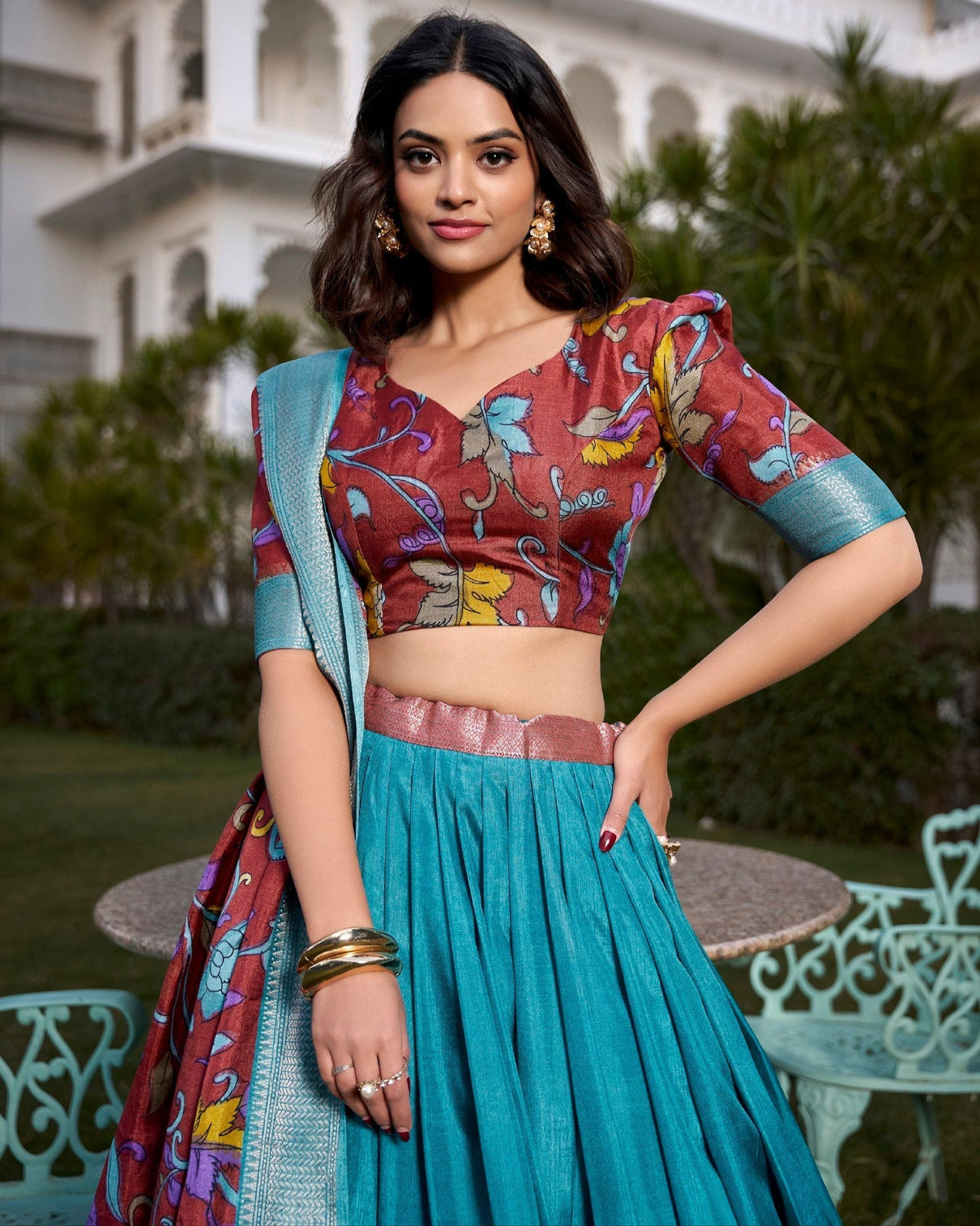 Exquisite aqua blue rust dola silk kalamkari lehenga set with zari weaving border