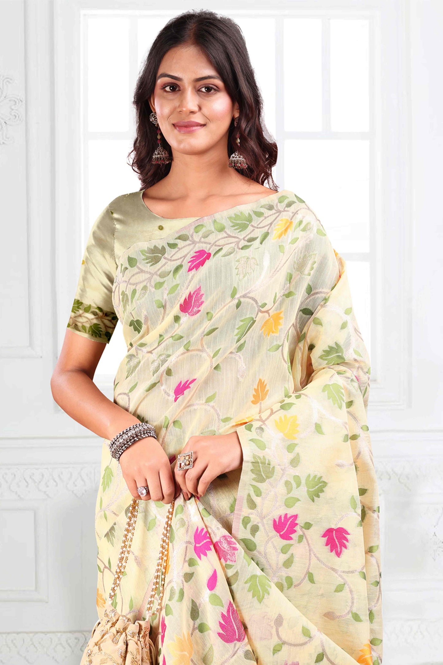 Cream Linen Cotton Silk  Saree Enhanced With Floral Zari Weaving & Tasselled Pallu Finish
