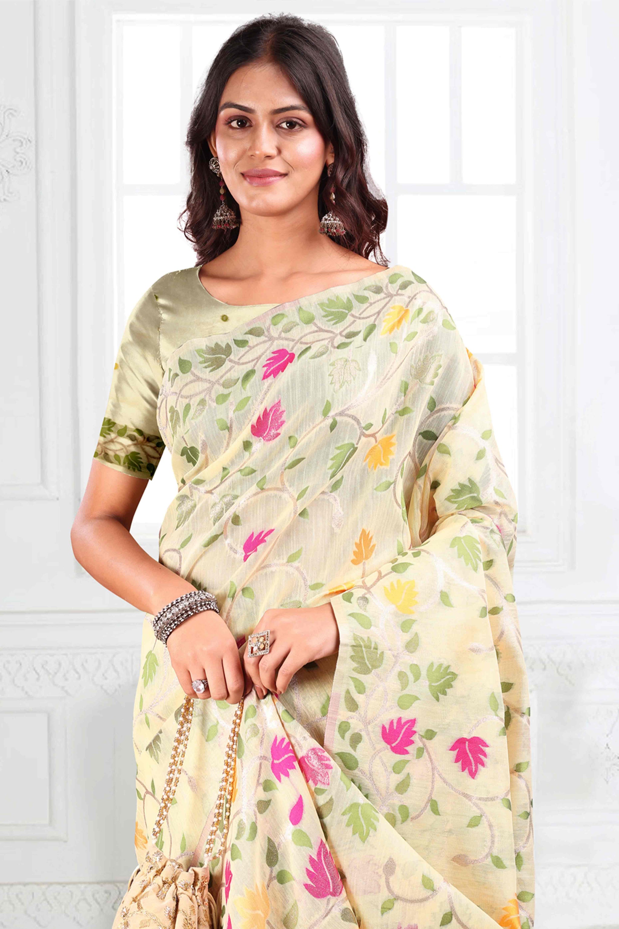 Cream Linen Cotton Silk  Saree Enhanced With Floral Zari Weaving & Tasselled Pallu Finish