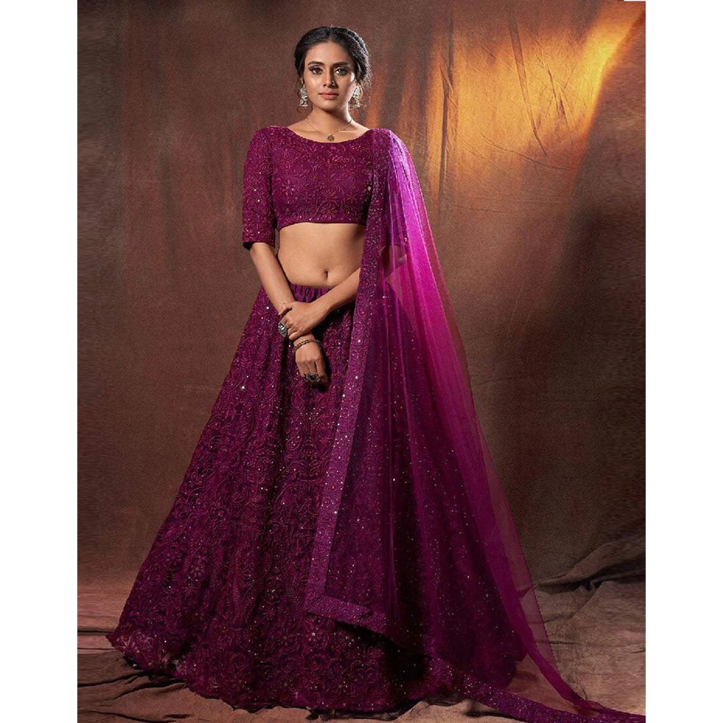 Designer Lehenga Choli in Net Fabrics and Wine Color with Embroidery Work