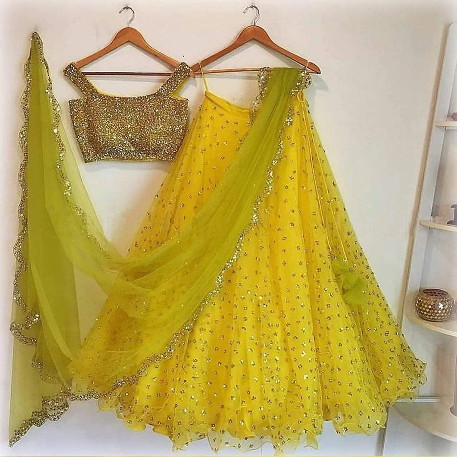 Designer Yellow Soft Net Lehenga Choli with Sequence Blouse and Readymade Dupatta