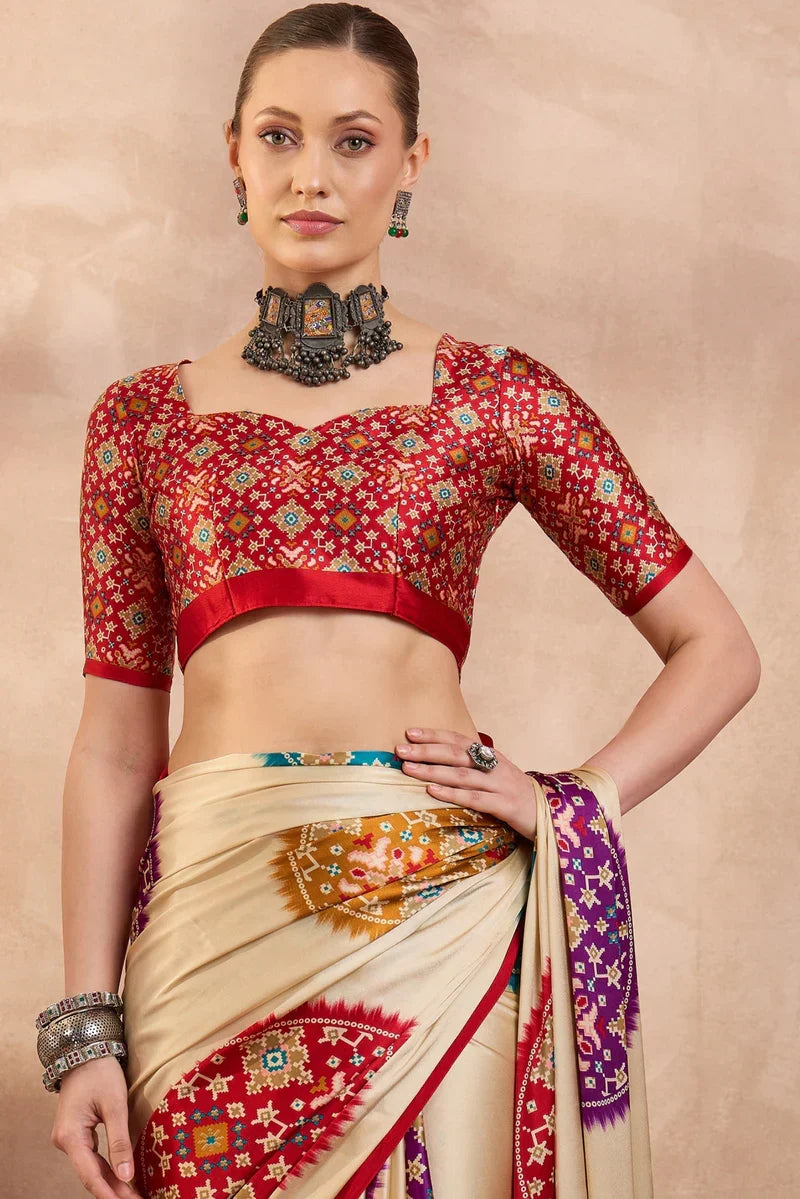 Cream modal silk saree with multicolor patola inspired print ruby red border designer festive wear saree
