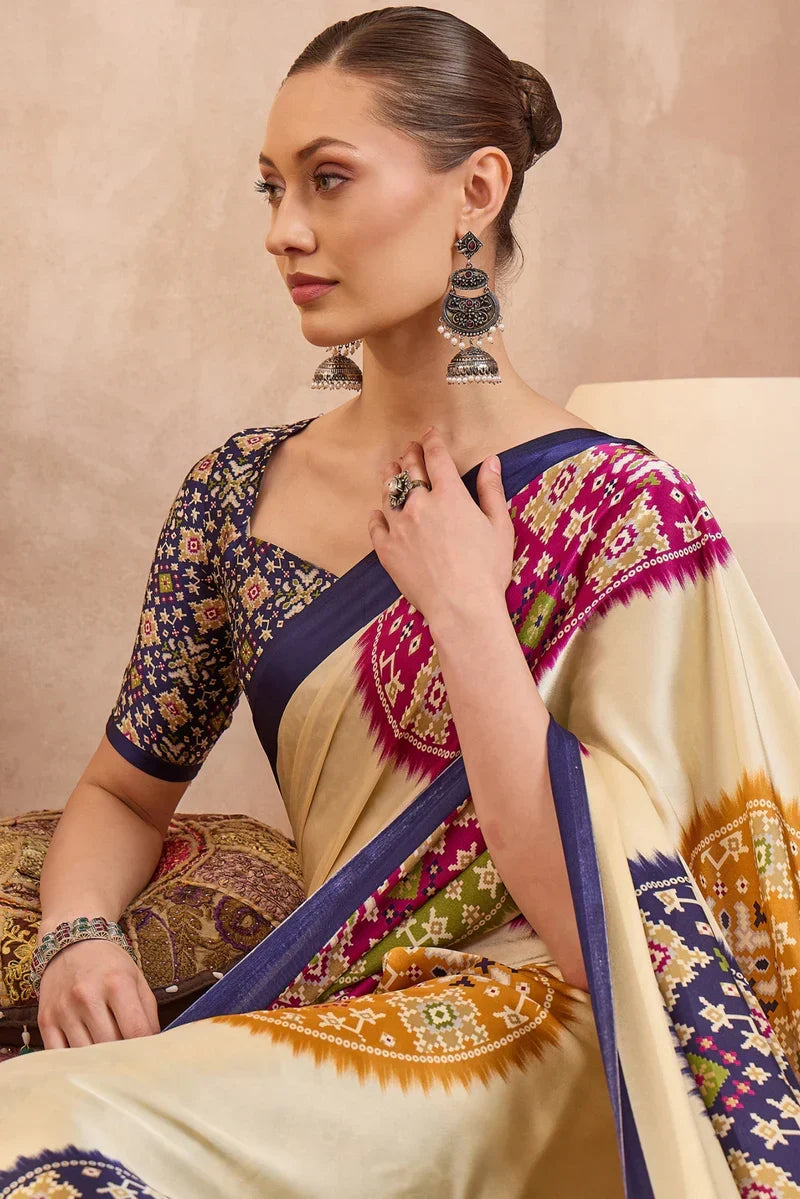 Cream modal silk saree with multicolor patola inspired print royal purple border designer festive wear saree