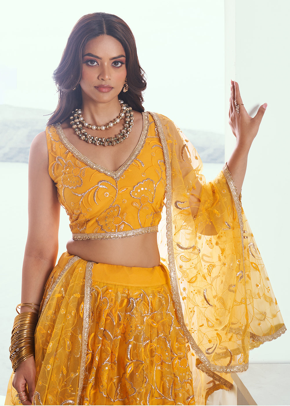 Exquisite Embroidered Net Yellow Wedding Wear Lehenga Choli