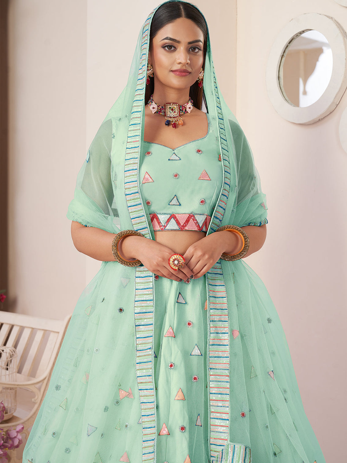 Turquoise Net Embellished Semi stitched Lehenga With Unstitched blouse