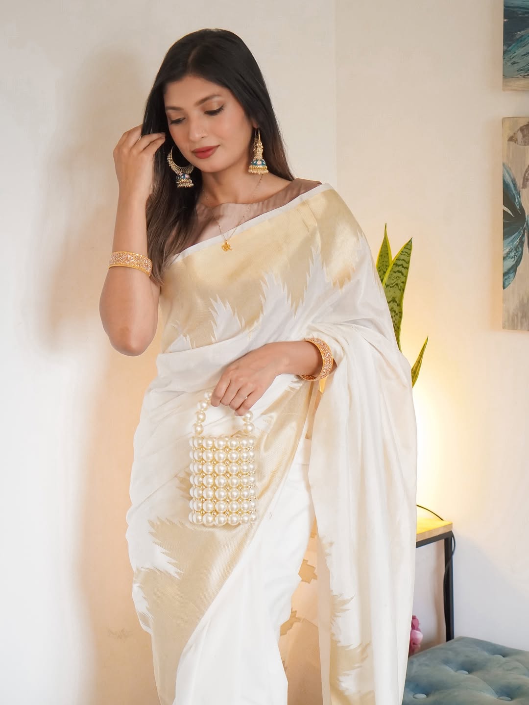 Symmetrical Beige Soft Silk Saree With Cynosure Blouse Piece
