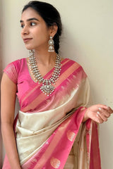 Cynosure Beige Soft Silk Saree With Delightful Blouse Piece