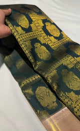 Profuse Dark Green Pure Zari Weaving Banarasi Silk Saree With Enchanting Blouse Piece