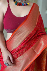 Magnetic Red Patola Silk Saree with Gratifying Blouse Piece