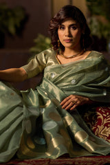 Murmurous Sea Green Soft Banarasi Tissue Silk Saree With Enticing Blouse Piece
