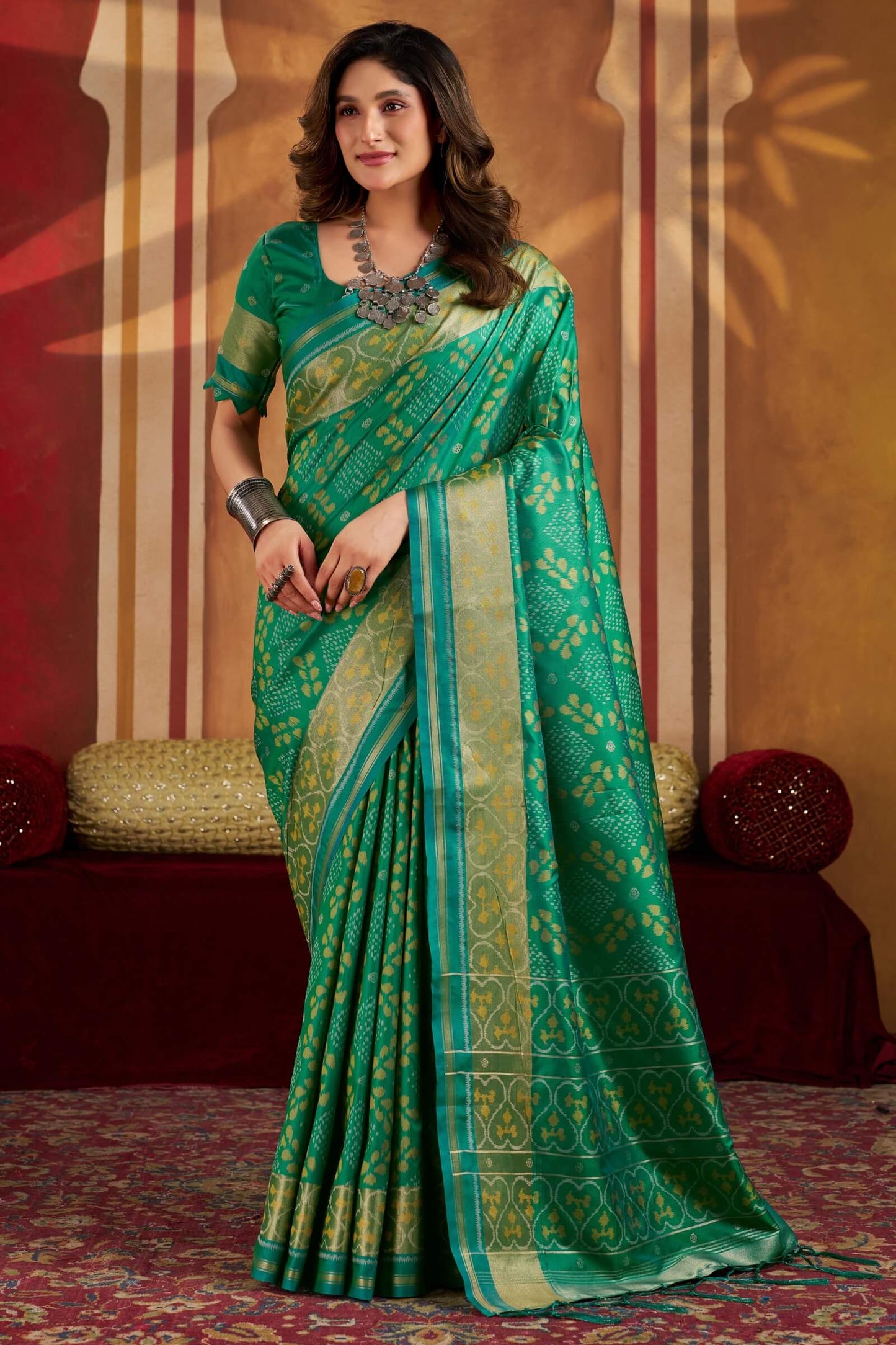 Gratifying Green Patola Silk Saree with Serendipity Blouse Piece