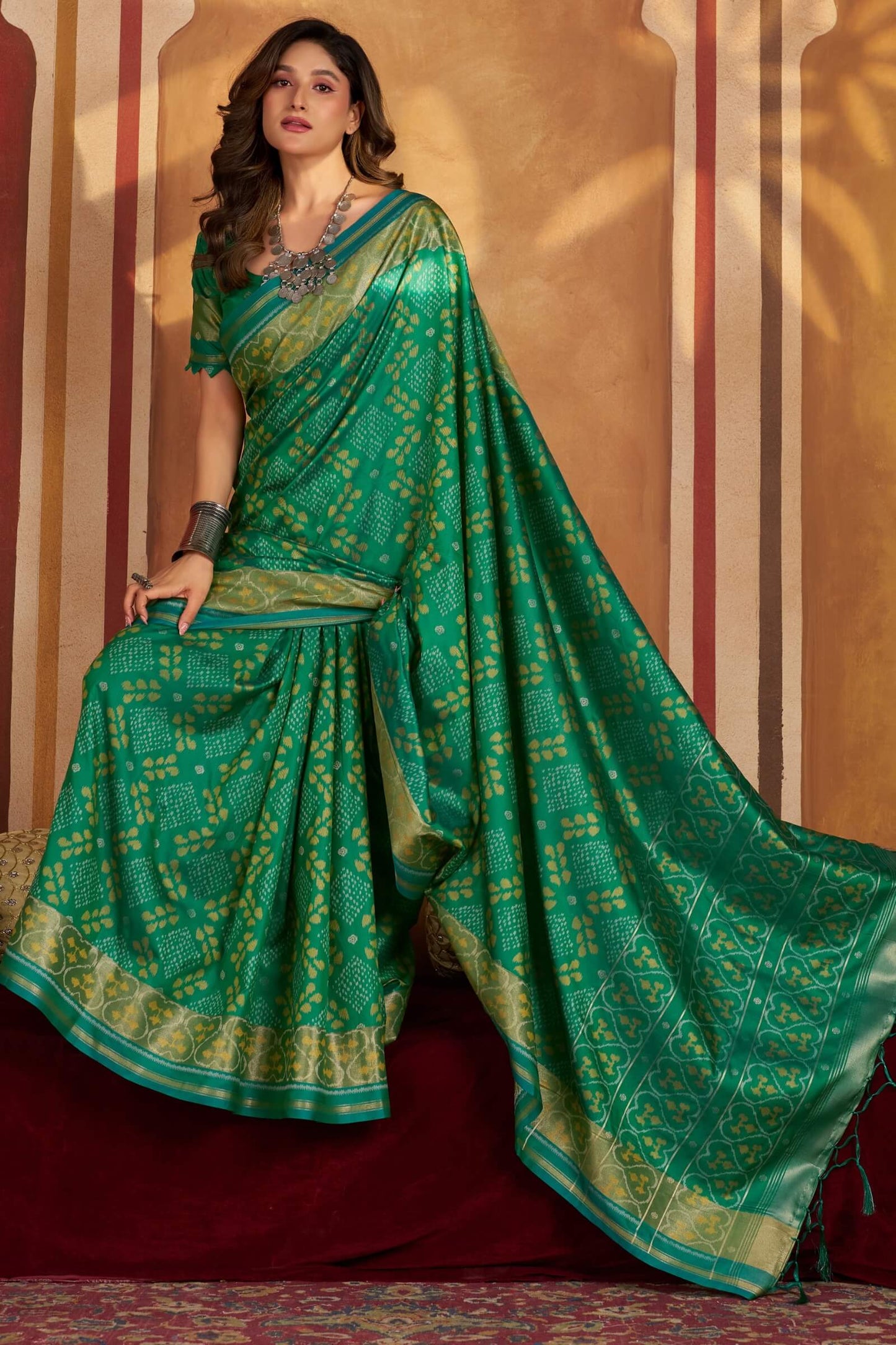 Gratifying Green Patola Silk Saree with Serendipity Blouse Piece