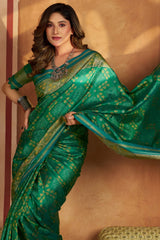 Gratifying Green Patola Silk Saree with Serendipity Blouse Piece