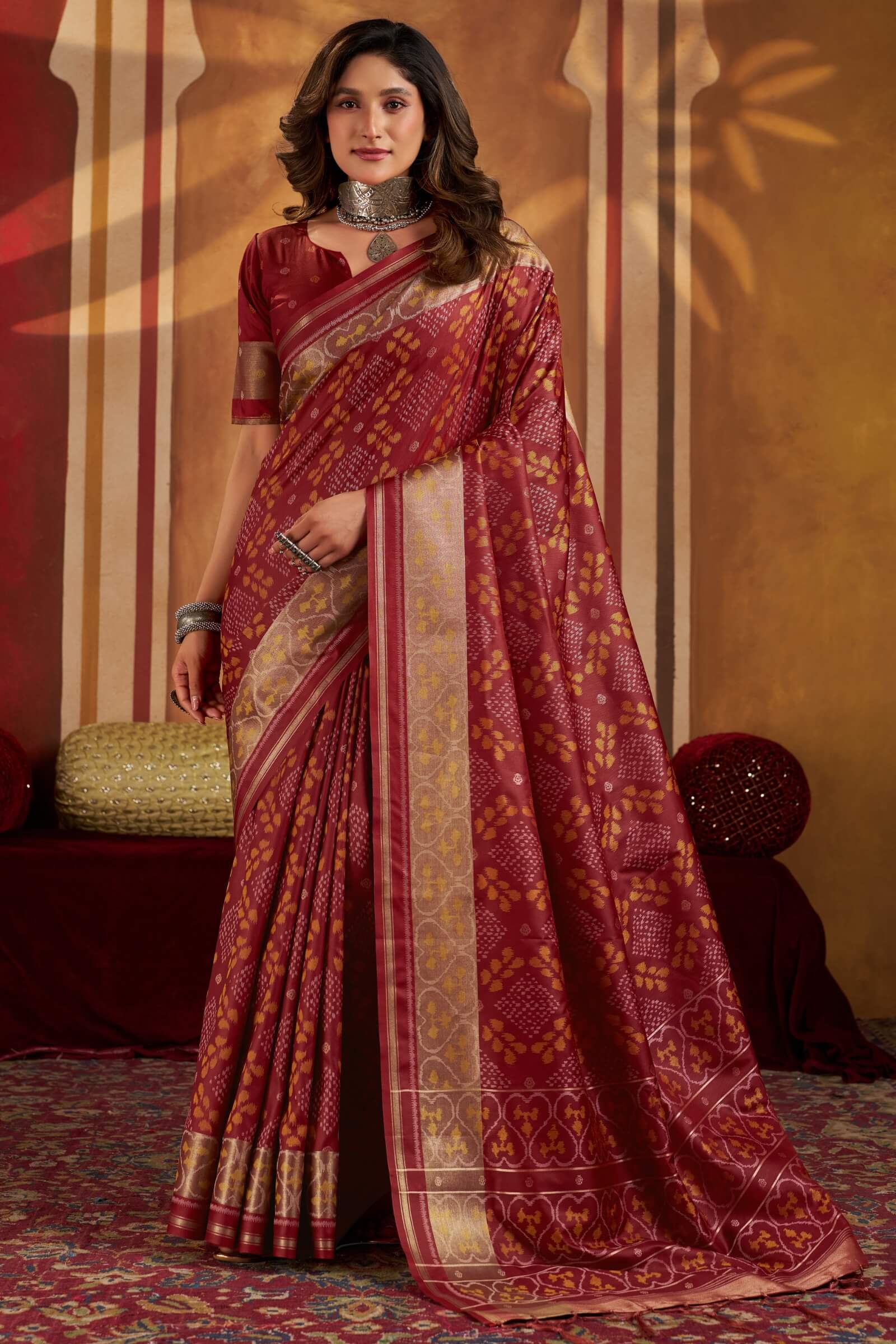 Staring Maroon Patola Silk Saree with Precious Blouse Piece