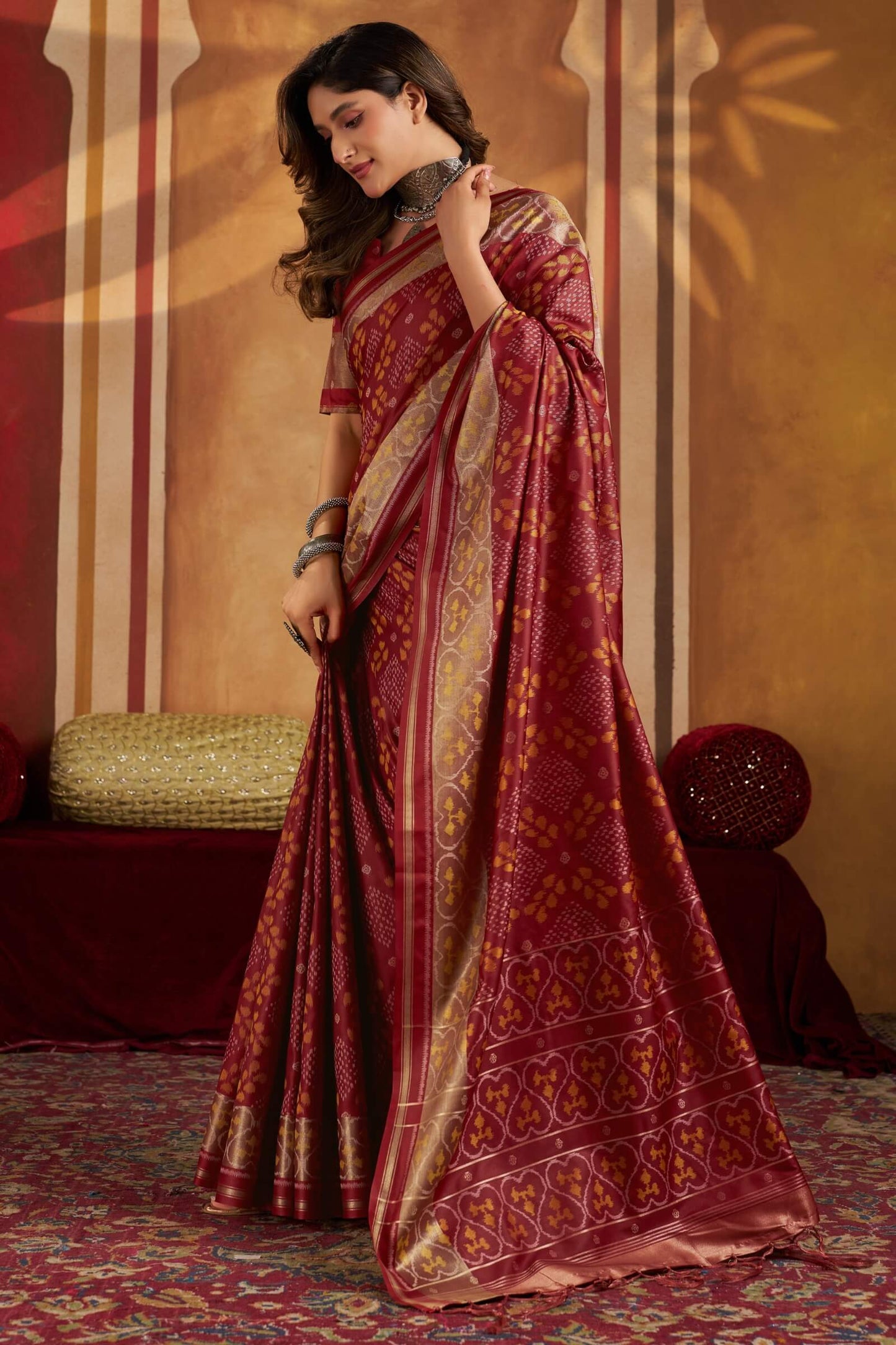 Staring Maroon Patola Silk Saree with Precious Blouse Piece