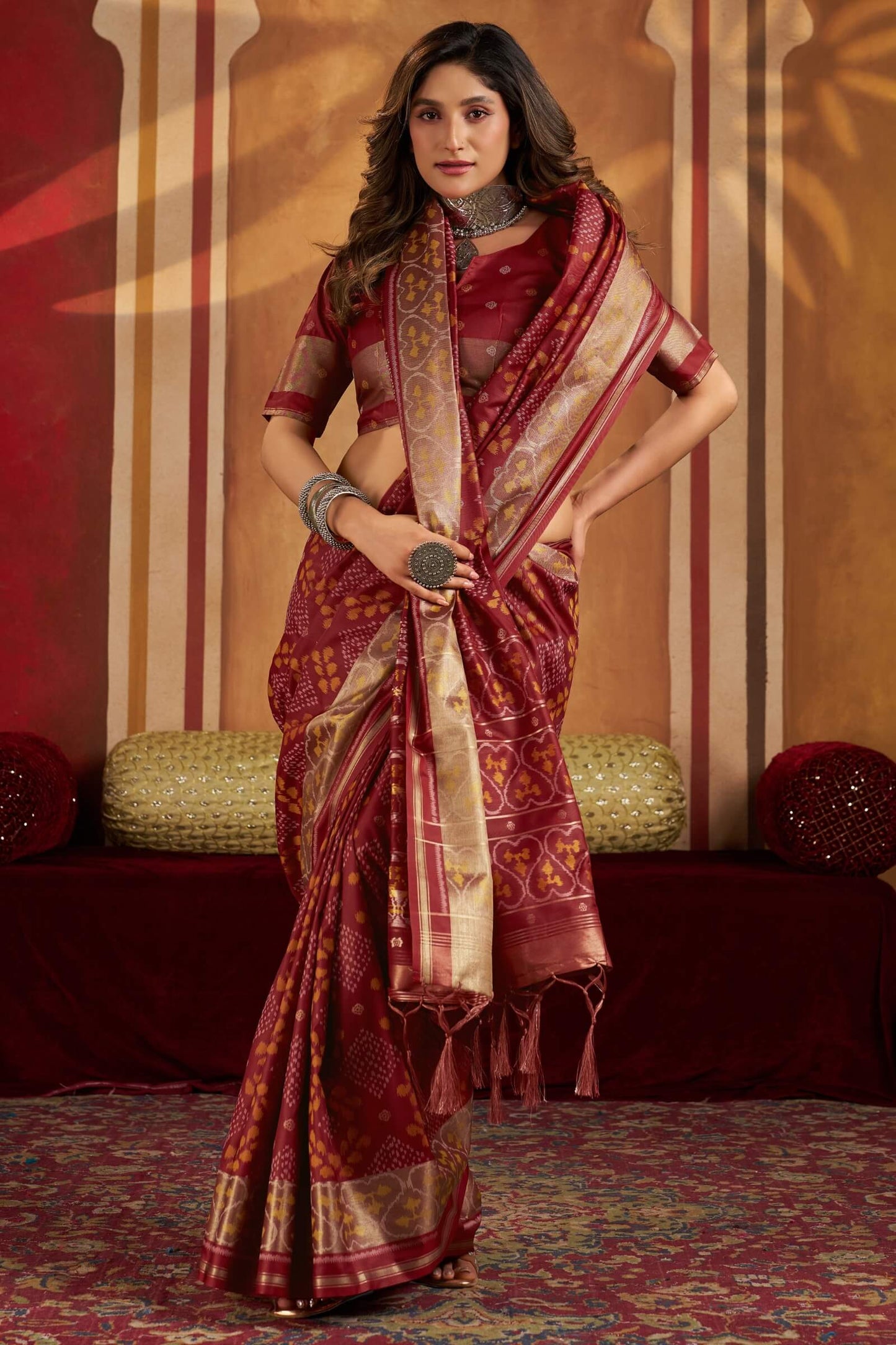 Staring Maroon Patola Silk Saree with Precious Blouse Piece