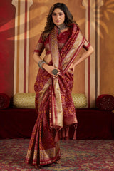 Staring Maroon Patola Silk Saree with Precious Blouse Piece