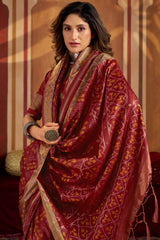 Staring Maroon Patola Silk Saree with Precious Blouse Piece