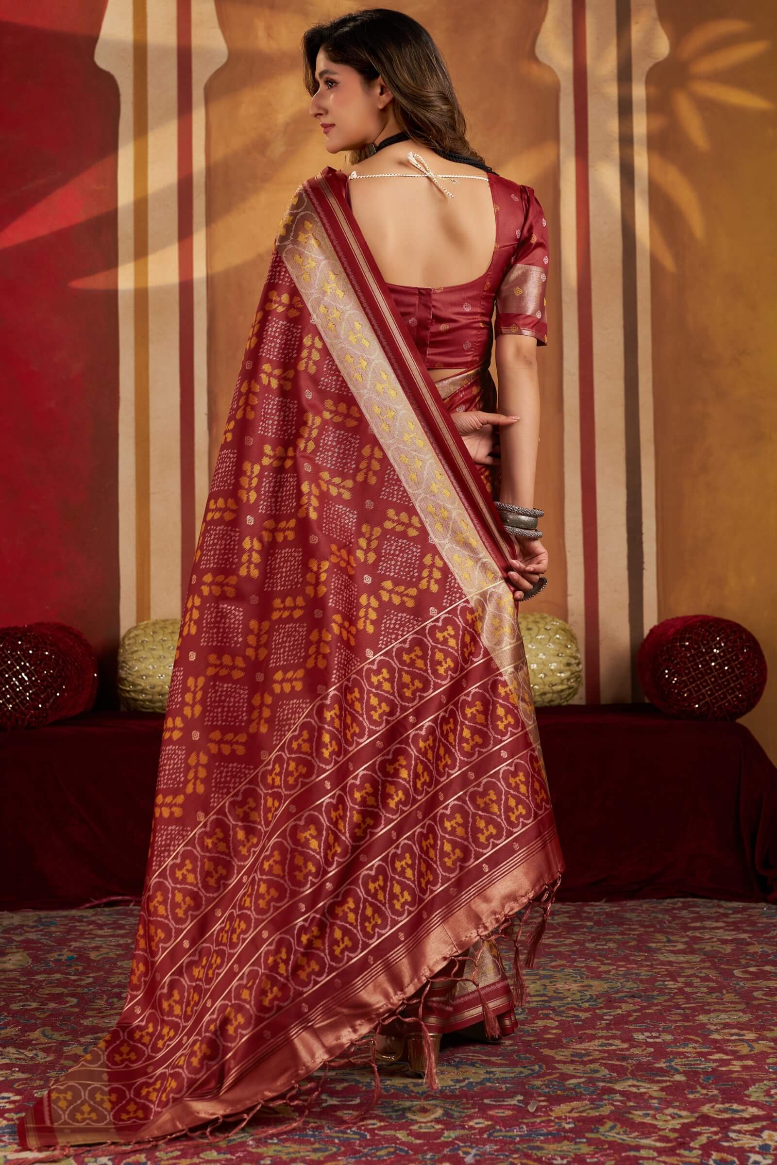 Staring Maroon Patola Silk Saree with Precious Blouse Piece
