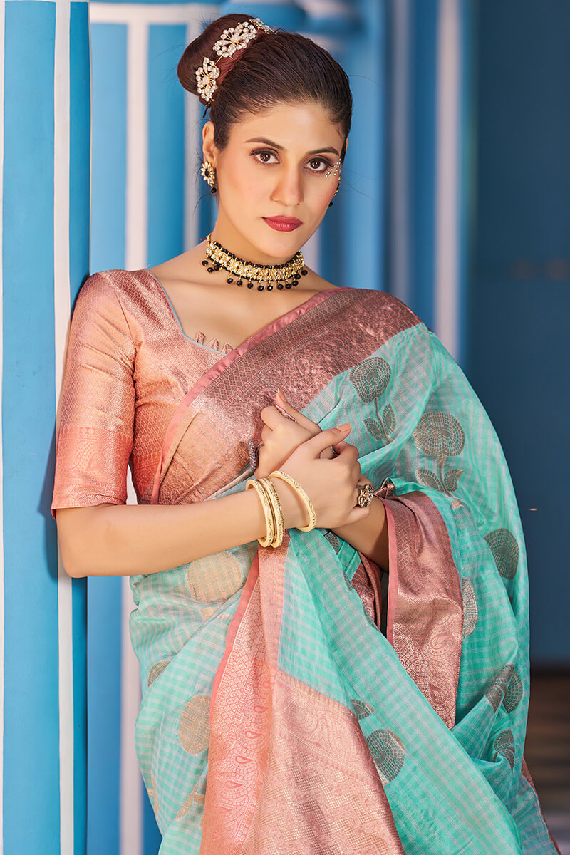 Luxuriant Sea Green Organza Silk Saree With Fantabulous Blouse Piece