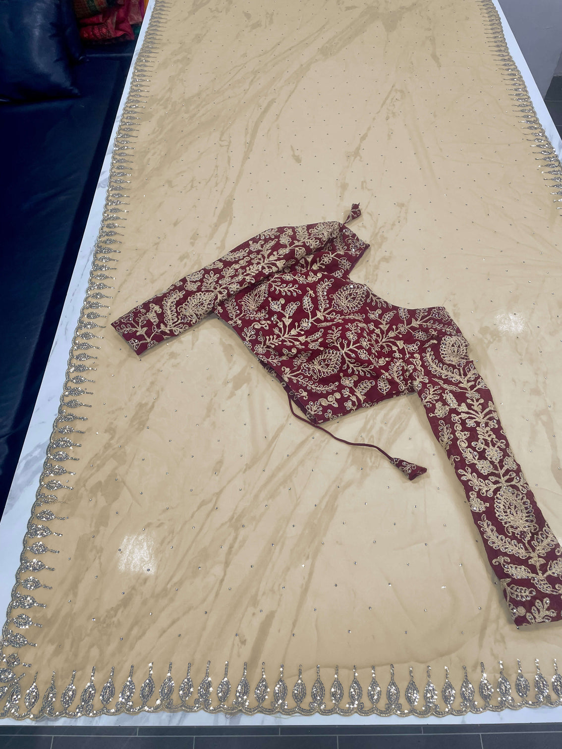 Beige Saree in Georgette With Heavy Embroidery And Maroon Blouse