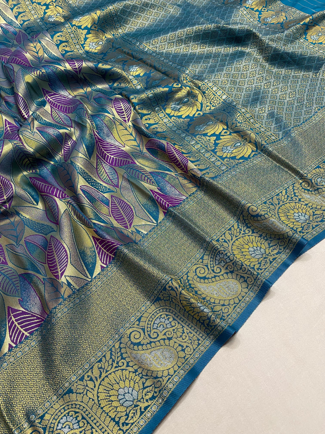 Turquoise kanchipattu silk party wear saree with all over weaves contrast border