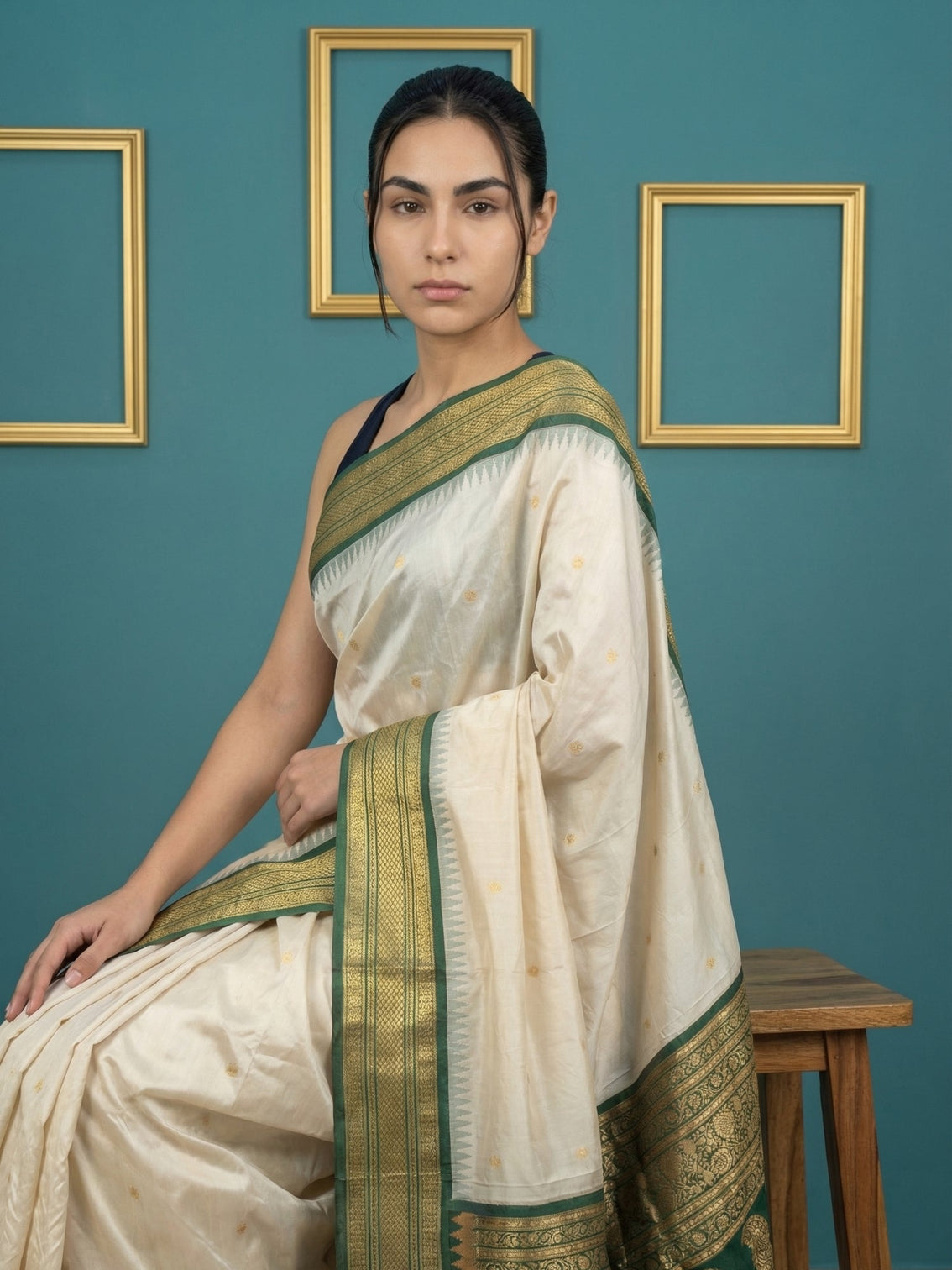 Cream soft silk saree with gold zari motifs and designer pallu