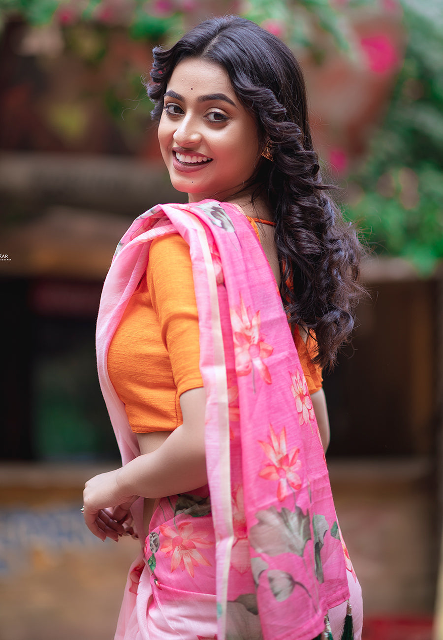 Dory in our baby pink chanderi cotton pichwai printed saree with zari woven border