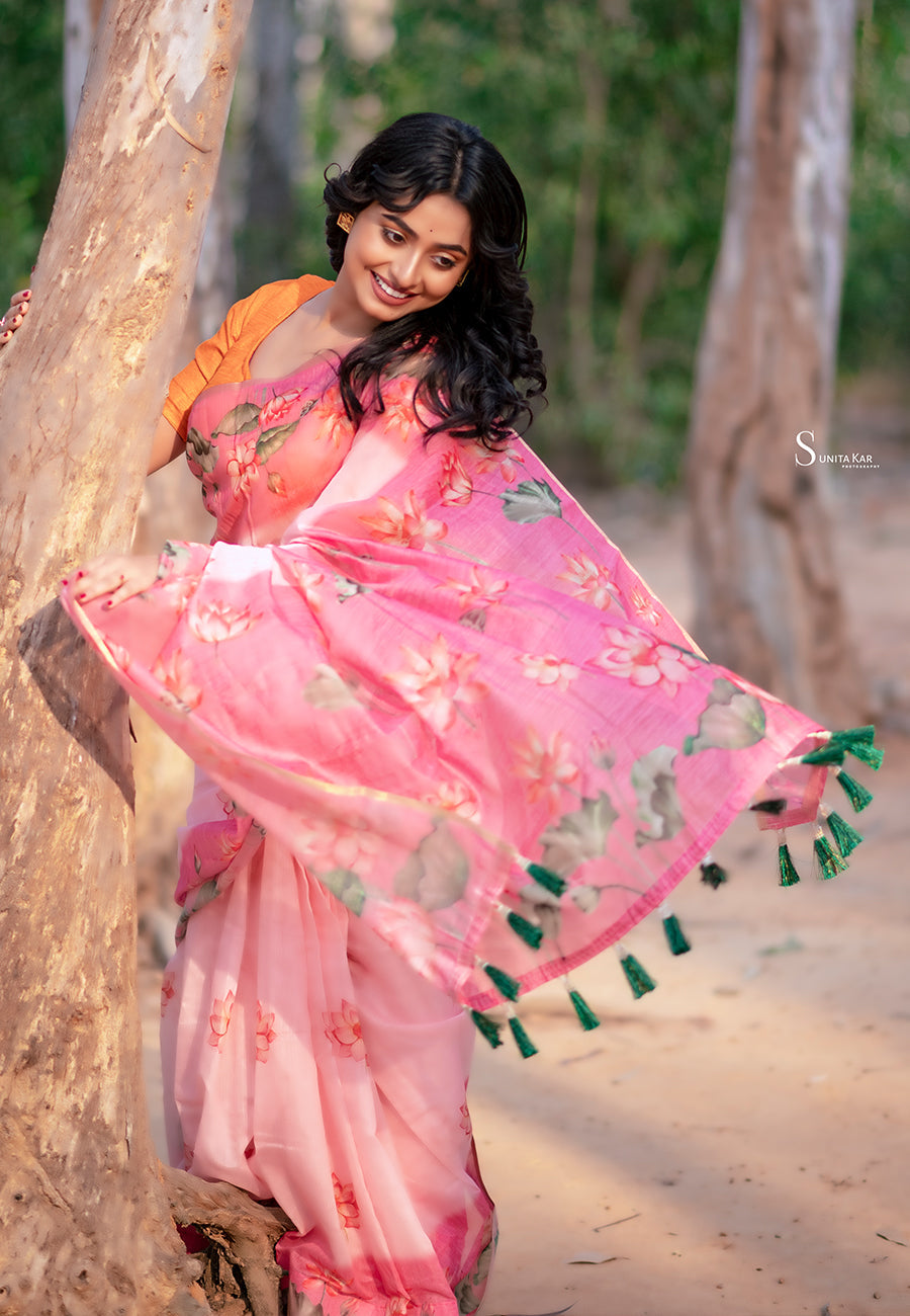 Dory in our baby pink chanderi cotton pichwai printed saree with zari woven border