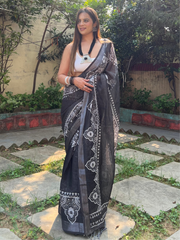 Black and white pure cotton linen saree with intricate floral design and tassels on edges mameraa
