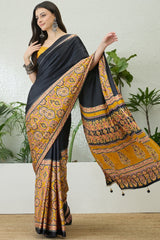 Jubilant Black Ajrakh Printed Semi Modal Silk Saree With Surpassing Blouse Piece