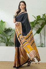 Jubilant Black Ajrakh Printed Semi Modal Silk Saree With Surpassing Blouse Piece
