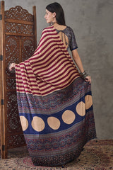 Prominent Maroon Ajrakh Printed Semi Modal Silk Saree With Engaging Blouse Piece