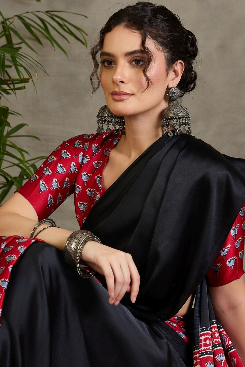 Effulgent Black Ajrakh Printed Semi Modal Silk Saree With Denouement Blouse Piece
